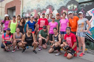 Digital Champions and Community Leaders stop for a picture in Graffiti Alley during the tweet up. Photo courtesy of Canada Running Series.