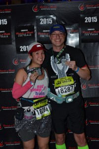Mei and Dan showing off the backs of their medals at the finish.